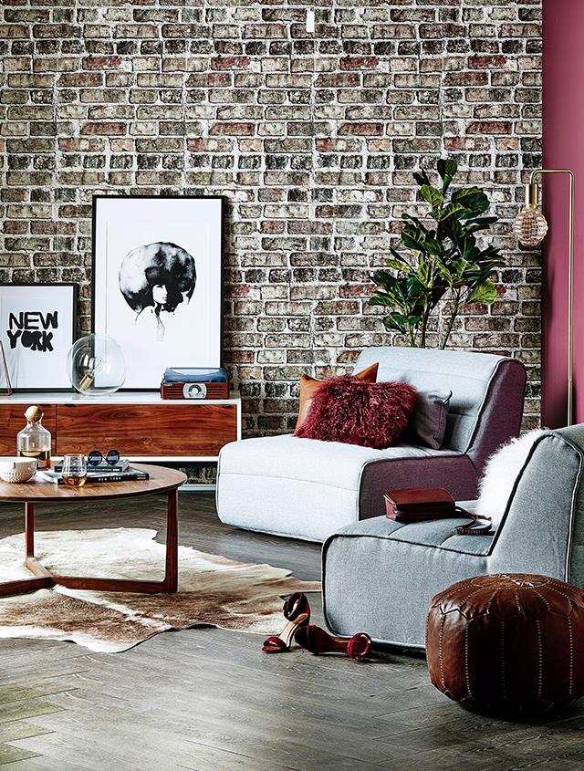 **Colourless and cohesive.** If your living room has a striking feature wall, opt for black and white prints, paintings or photos. They'll prevent the room from feeling too busy or cramped. It's also a clever way to ensure all your artworks will work cohesively if you want to display your collection in one given space. *Photography: Scott Hawkins/ bauersyndication.com.au*