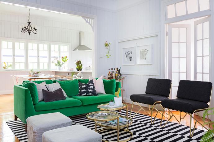 The bright and airy open-plan living-dining space is Katie's favourite. The statement green velvet sofa is from Ikea.
