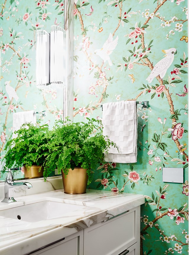 Eye-catching and uplifting, this emerald-green, floral wallpaper paired with simple yet classic bathroom fixtures, instantly modernises the interior of this [Georgian brick home](http://www.homestolove.com.au/1930s-georgian-brick-home-honours-late-designers-vision-5654). *Photo: Lisa Cohen / Belle*