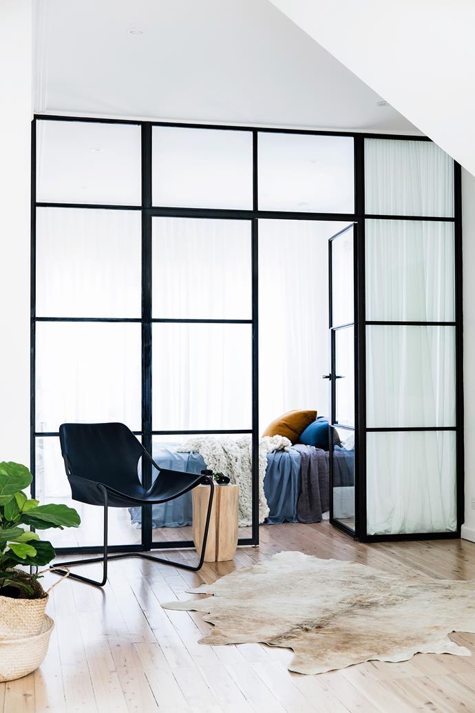 The owners were keen to use black [steel-framed windows](https://www.homestolove.com.au/black-framed-window-door-17773|target="_blank") somewhere in the home. These Skyrange windows created a multifunctional space used as a fourth bedroom, study and playroom. The heavy linen curtains from Simple Studio provide privacy.