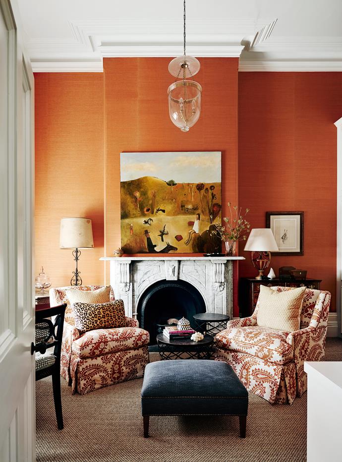 **Tangerine Dream by [Adelaide Bragg & Associates](http://www.adelaidebragg.com.au/|target="_blank"|rel="nofollow")**. Bold new upholstery on the chairs was the starting point in the refurbishment of a once-drab Melbourne living room. Flash forward to this alluring space, endowed with rich colour and texture. "Our family uses it for watching TV, or as a quiet spot to think and read and sit by the fire," say the owners. Drawing them to the marble hearth is an intriguing artwork set against fine sisal wallpaper. More sisal on the floor amps up texture, while lights set at various heights establish a sense of balance. *Photography: Lisa Cohen*
