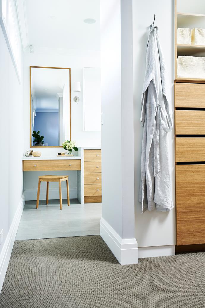 A custom walk-in wardrobe leads to the ensuite.