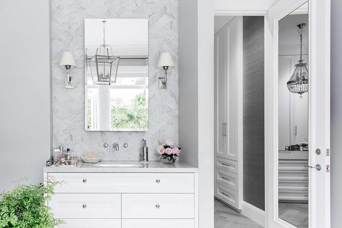 The clean white colour scheme in the 'hers' ensuite is anything but minimal.