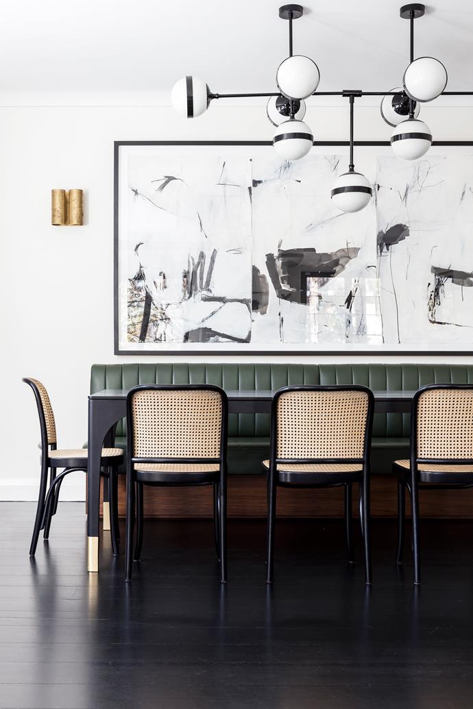 'Hoffmann' chairs fromThonet. 'Peggy Futura' chandelier by Vistosi. Wall sconces by Kelly Wearstler. Artwork, Memory Recaptured Through Daydreams by Antonia Mrljak.