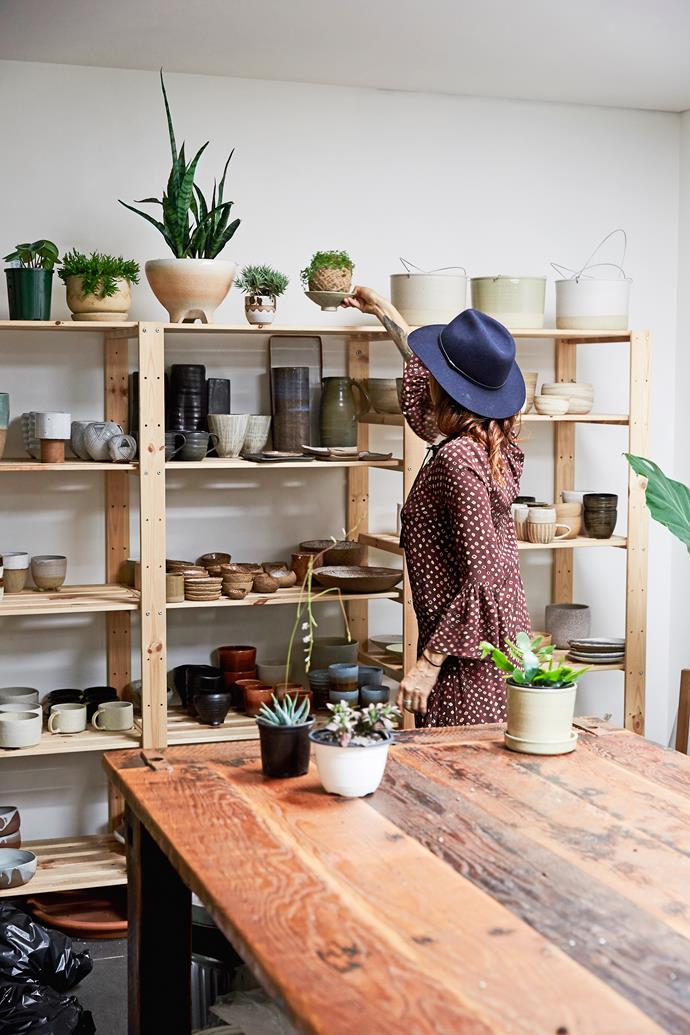 "I wanted to create a space where when you walk in, you feel like you're walking into someone's home," Emma says. Handcrafted furniture by JD Lee and Dion Antony is displayed alongside ceramics, planters, artworks and wall hangings.