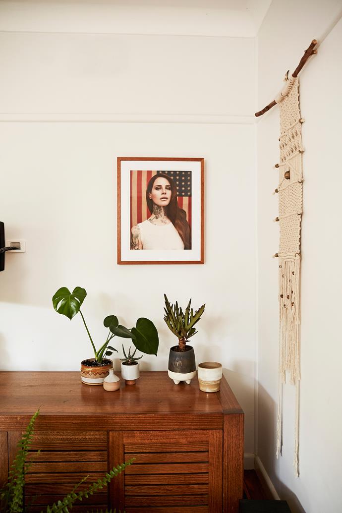 Artworks of Lana Del Rey and Elvis Presley by Cheynne Randall hang in Emma's home and her store. "He did a whole series, placing tattoos over people," she says. "They're amazing."