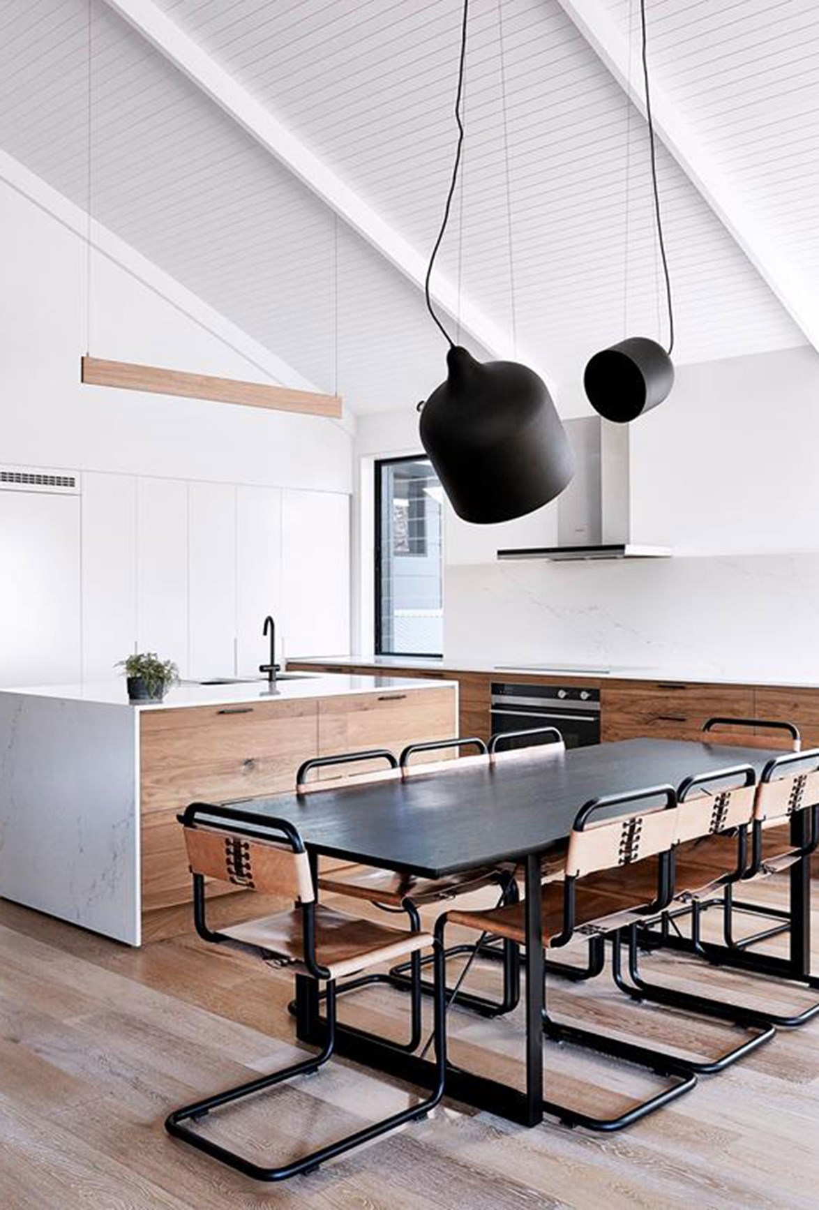 Open-plan kitchens that double as dining rooms are excellent for entertaining. Photo: Terence Chin