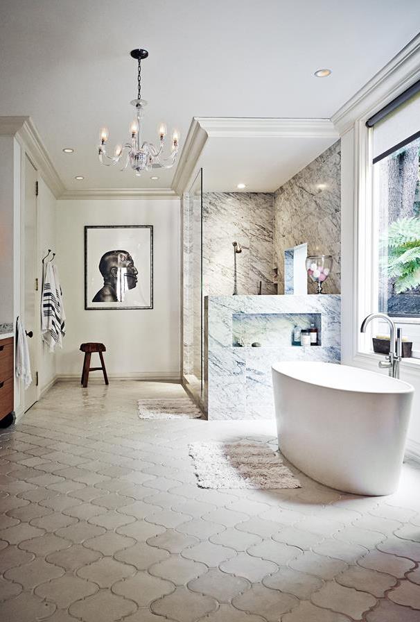 An antique chandelier, custom-made Moroccan floor tiles and a large all-marble shower enclosure boast luxury in this [laid-back family home](https://www.homestolove.com.au/a-laid-back-family-home-with-eclectic-luxe-style-4150|target="_blank") with eclectic style. *Photo: Martin Lof*