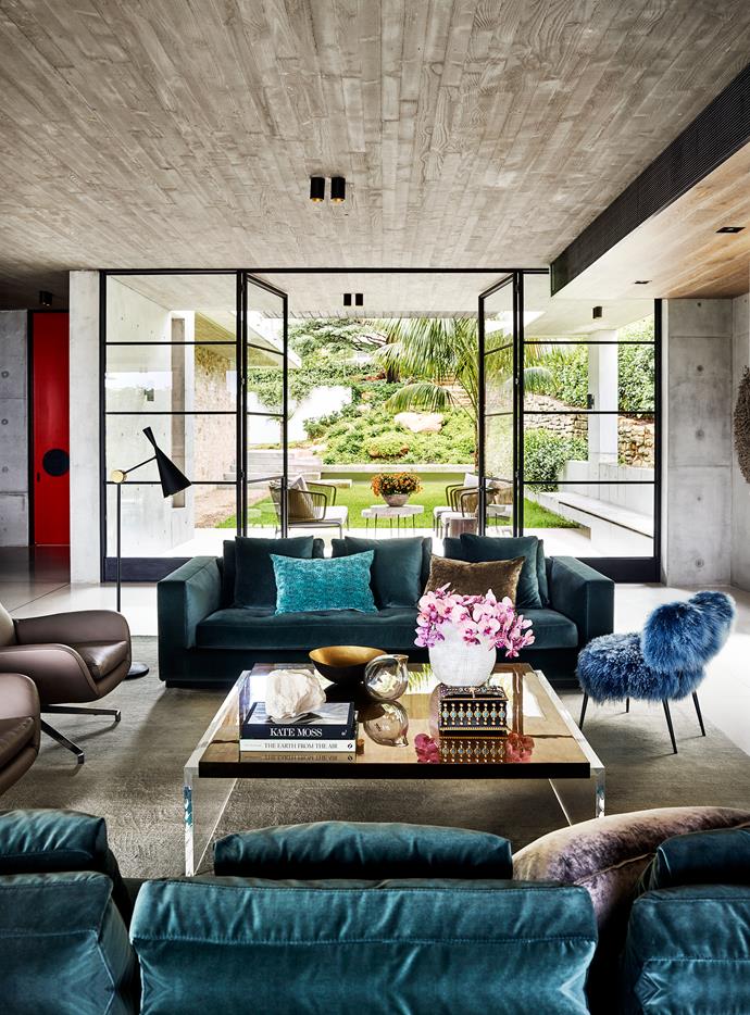 In the main living area, Minotti 'Andersen' sofas and Tom Dixon 'Beat' floor lamp from De De Ce. Ombre silk rug from Tibet Sydney. Baxter 'Nepal' chair from Criteria. Cushions from Tigger Hall Design and Seneca Textiles.