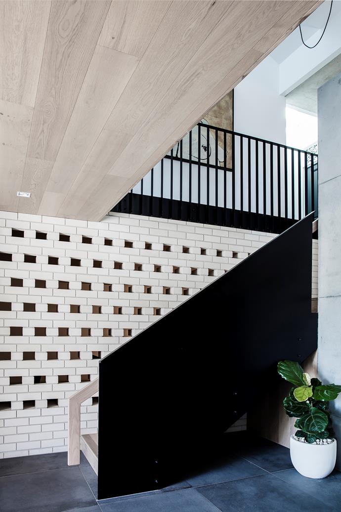 In the stairwell, bricks were laid in a pattern that is decorative and ensures good ventilation. 'Bowral' bricks in Chillingham White from Austral Bricks.