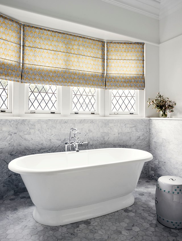 Tiles are taken up the walls on all sides, framing this Victoria & Albert 'Elwick' bath and adding a touch of Hollywood to [this glamourous bathroom](https://www.homestolove.com.au/a-spanish-mission-style-homes-hollywood-glamour-update-6677|target="_blank").
