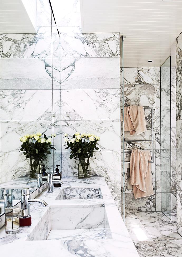 Using the same marble on walls and floor creates a seamless, more spacious bathroom. *Photo: James Greer / Bauersyndication.com.au*