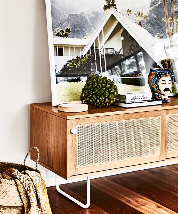 Another corner of the open-plan living area has a decidedly [mid-century modern retro](https://www.homestolove.com.au/mid-century-retro-interiors-4189|target="_blank") air, with an Iluka sideboard from Jardan and Swiss Miss photo of Palm Springs by James Geer.