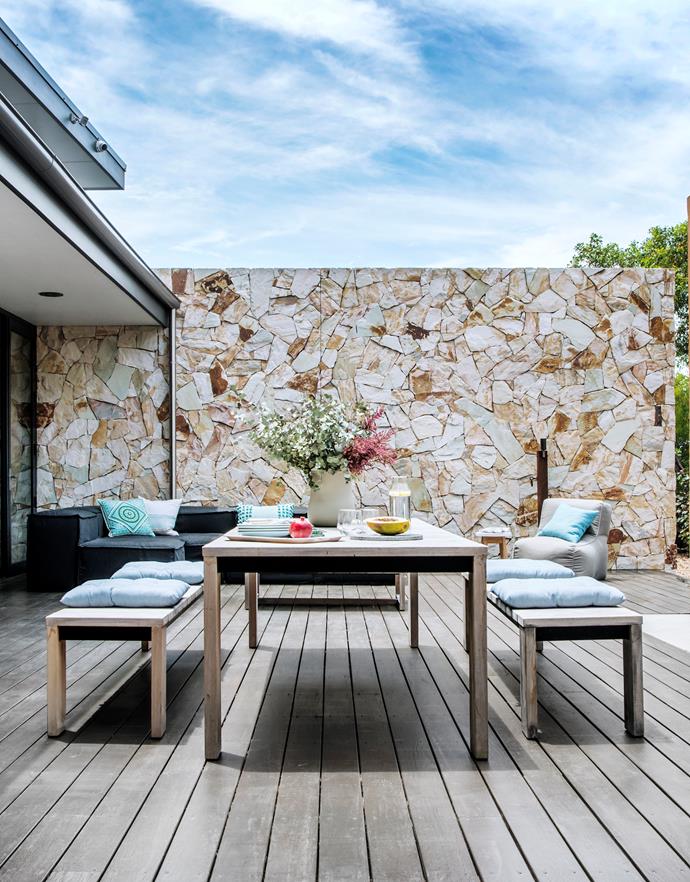 A retractable shade will soon be installed over the entertaining area, which should enhance its useability. 'Bronte' dining table and matching benches, 'Ord' outdoor sofa and 'Byron' beanbag chair, from Eco Outdoor.