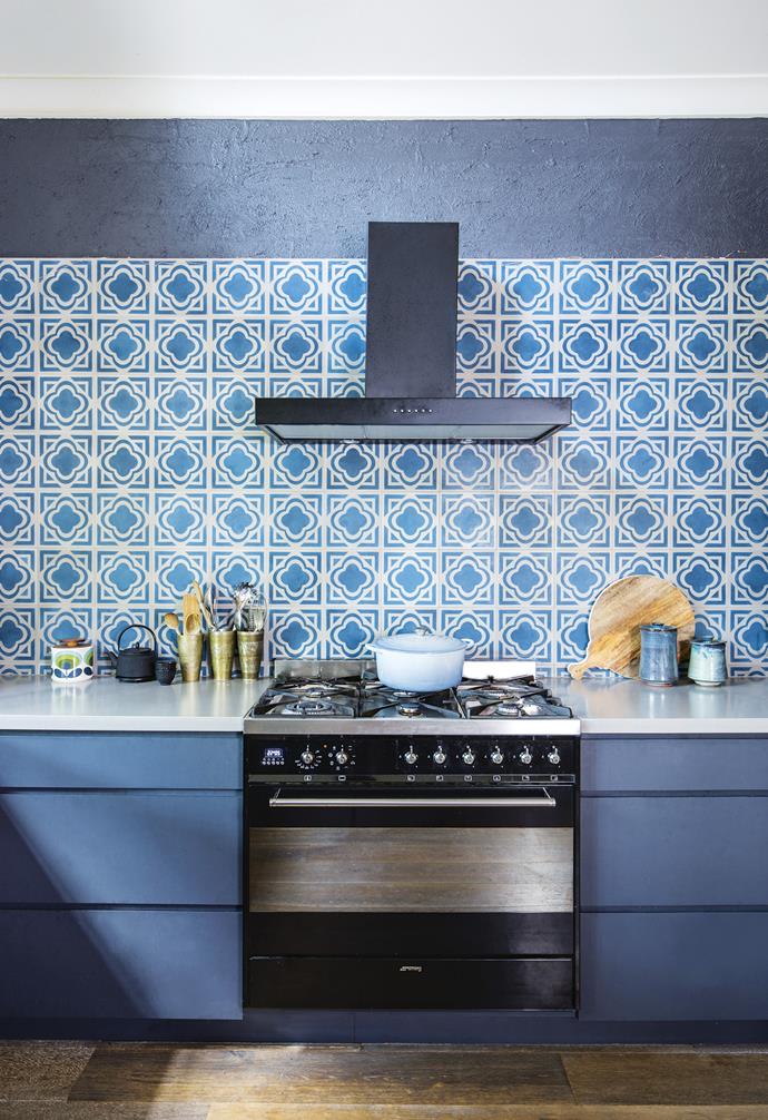 **Boho twist** The Moroccan-style encaustic tiles on this splashback add a bohemian twist to this mostly dark-toned kitchen. The dramatic pattern is complemented by the soft grey benchtops and deep blue cabinetry. *Styling: [Clair Wayman](https://www.instagram.com/curioandcurio/|target="_blank"|rel="nofollow") | Photography: Tanika Blair*.
