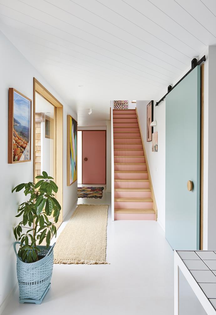 **Hallway** The large artwork by Clare O'Donoghue, plus stair risers in [Haymes](http://www.haymespaint.com.au/|target="_blank"|rel="nofollow") Paint Aleaha Rose and barn door in Haymes Paint Pitch Pine, set a playful mood. The concrete floor is finished in a white epoxy coating for a clean, fresh look. Artwork: (on wall beside stairs) large painting by Tory Burke, [Studio Elwood](https://www.studioelwood.com.au/|target="_blank"|rel="nofollow"), small painting by [Rachel Prince](http://rachelprinceart.com.au/|target="_blank"|rel="nofollow"). Planter basket, [The Family Love Tree](https://thefamilylovetree.com.au/|target="_blank"|rel="nofollow"). *Styling: Emma O'Meara | Photography: Nikole Ramsay*.