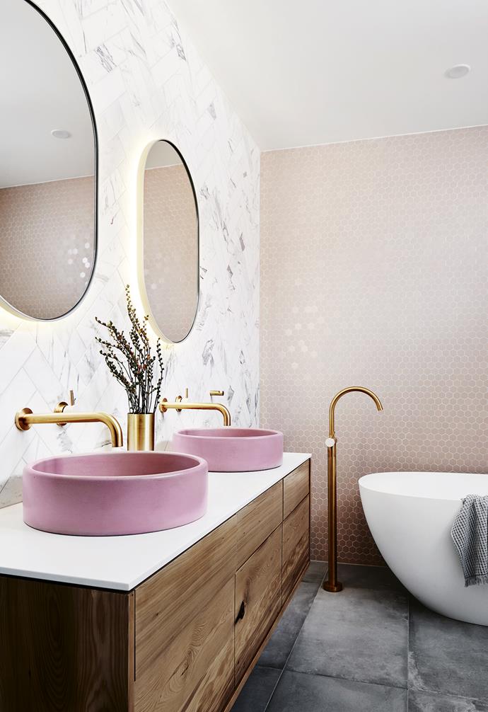 **Lighten up** Nat worked with [Gerard Lighting](https://gerardlighting.com.au/welcome|target="_blank"|rel="nofollow") to install a smart Diginet lighting system throughout the house. "If anyone walks into the bathroom during the night, the sensor LED lights behind the mirrors will turn on automatically," says Nat. **Bathroom** Gold tapware from [Sussex Taps](https://sussextaps.com.au/|target="_blank"|rel="nofollow") complements the blush, grey and timber tones.