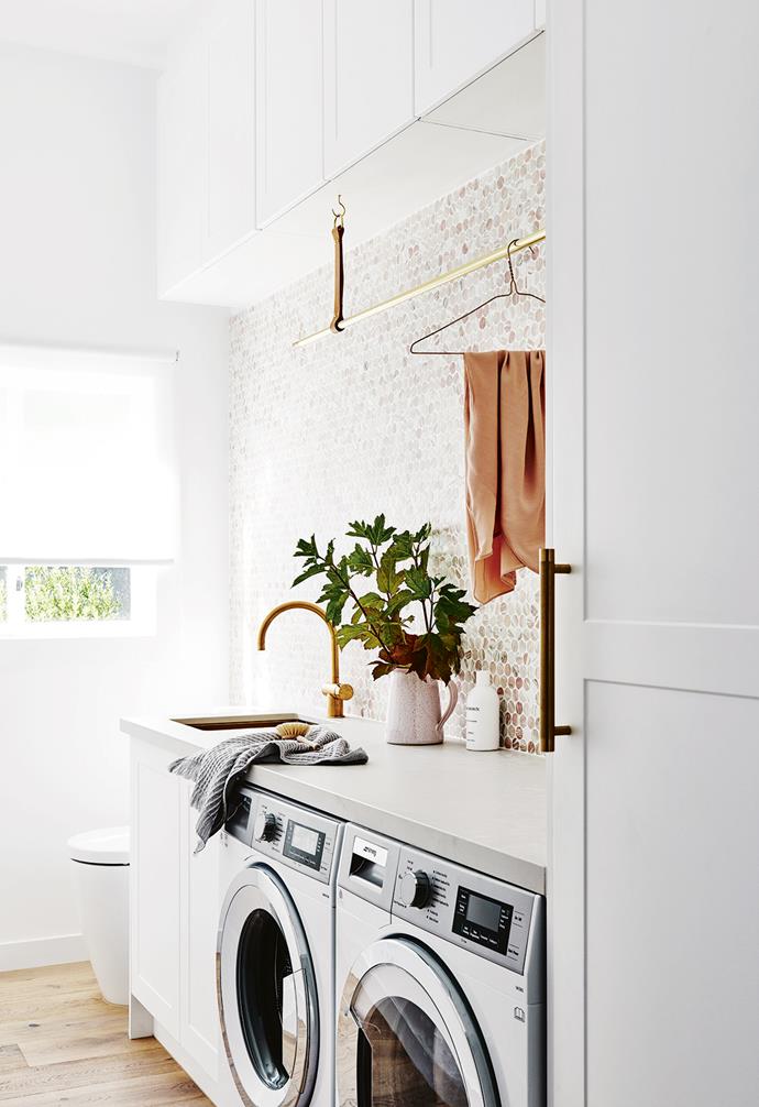 **Laundry** Nat kept her appliances side by side to maximise the bench space, so that all the folding and sorting can happen within the laundry. The curved tap from [Sussex Taps](https://sussextaps.com.au/|target="_blank"|rel="nofollow") matches the gold-toned sink from [ABI Interiors](https://www.abiinteriors.com.au/|target="_blank"|rel="nofollow").
