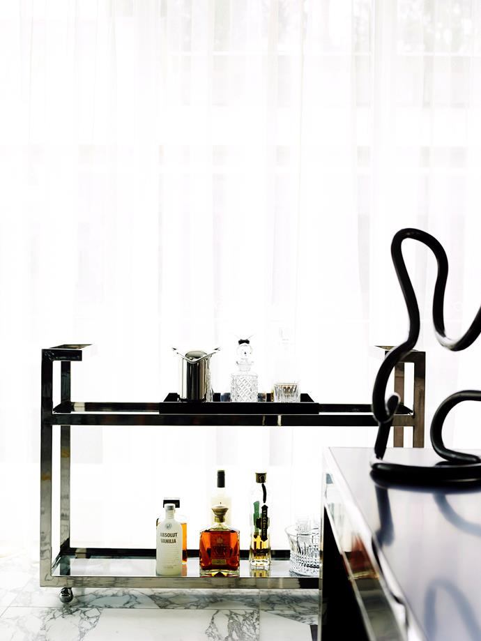 A well-stock and styled drinks trolley is a great way to invite guests to fix a drink for themselves. Photo: Anson Smart / *bauersyndication.com.au*