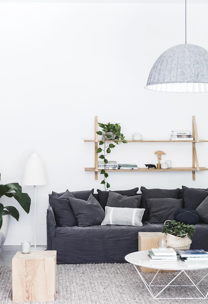 **Living area** The large Muuto 'Under The Bell' pendant light adds texture and softness above a cosy MCM House sofa. The sleek GlobeWest coffee table is complemented by a pair of Mark Tuckey timber side tables. 'Assemblages' shelving, [Lightly](https://www.lightly.com.au/|target="_blank"|rel="nofollow"). Lightyears 'Caravaggio' floor lamp, [Royal Design](http://royaldesign.com/au/|target="_blank"|rel="nofollow"). 'Aura' plait rug, [Globewest](https://www.globewest.com.au/|target="_blank"|rel="nofollow").