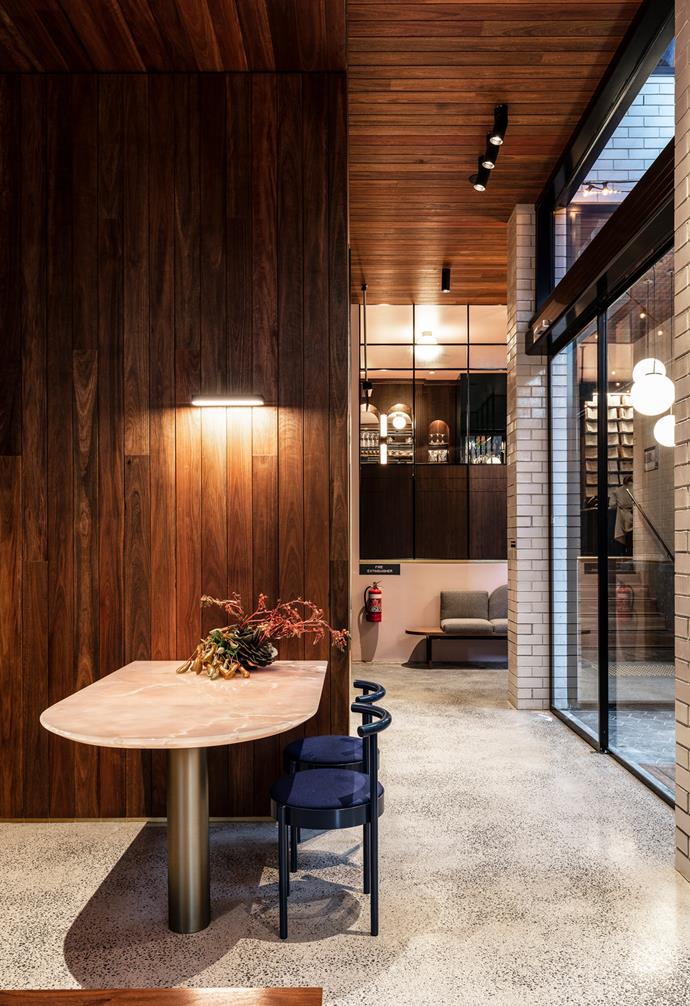 **Timber it up** The creative use of timber on the ceiling creates a cosy vibe in this space.