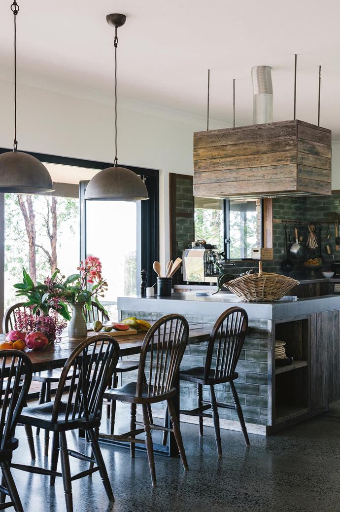 A love of gardening led Chat Thai's Palisa Anderson to found a 46-hectare [organic farm in the Byron Bay hinterland](https://www.homestolove.com.au/chat-thai-organic-family-farm-18825|target="_blank"). Her two other loves - upcycling furniture and cooking - are on show in her deeply-hued kitchen. The teak slabs that form her tabletop, for example, were purchased at auction. Parts of the kitchen are also clad in recycled timber fence posts. "We wanted a home that was comfortable, that had places for people to sprawl and communal spaces where we could gather," says Palisa.