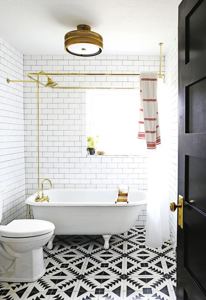 **Bathroom** The couple purchased the claw-foot tub from a family renovating their own home for US$900. The 'Greta' light fitting is from US retailer Safavieh and the 'Tulum' encaustic floor tiles from Cement Tile Shop. Brass shower rail, [Vintage Tub & Bath](https://www.vintagetub.com/|target="_blank"|rel="nofollow").