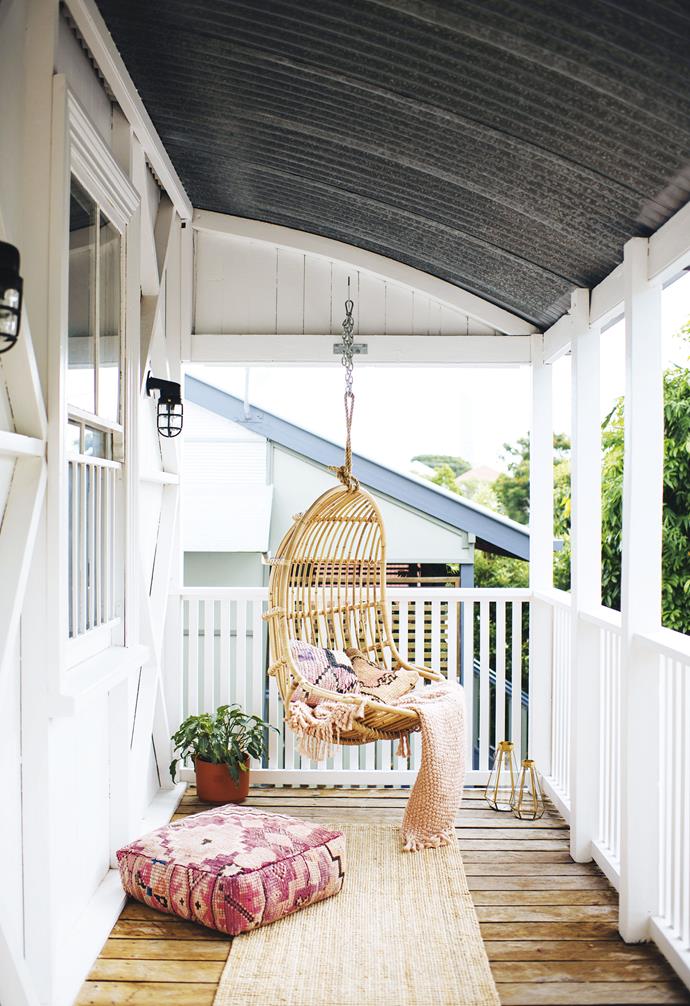 **Front verandah** "This is a tiny area, but it's so relaxing in the afternoons," says Geneva. She can sway on The Bach Living hanging chair while Ben flops out on a Moroccan floor cushion from Marr-kett. Throws & lanterns, [West Elm](http://www.westelm.com.au/|target="_blank"|rel="nofollow"). 'Lohals' rug, [IKEA](https://www.ikea.com/|target="_blank"|rel="nofollow").