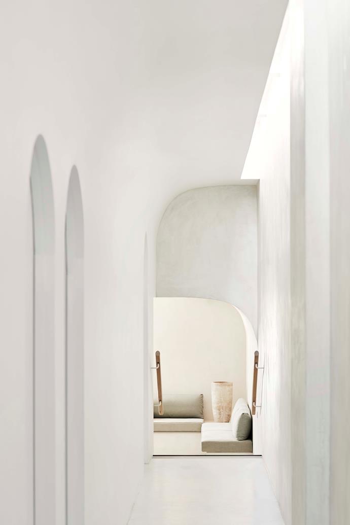 Curved walls, ceilings and archways complement the existing architecture and are finished in hand-rendered cement.