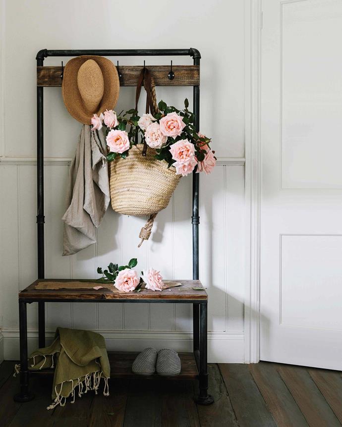 'Cinderella' hybrid tea roses overflow from a basket on the [vintage clothes stand](https://www.ebay.com.au/itm/303318607961|target="_blank"|rel="nofollow") that Sandy found on [eBay](https://www.ebay.com.au/itm/303318607961|target="_blank"|rel="nofollow"). *Photography: Marnie Hawson*