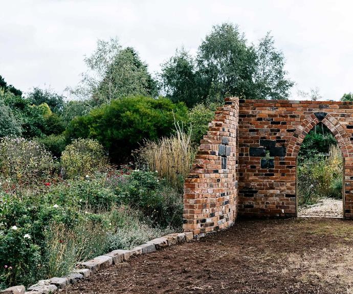 The brick folly by Tom Hamlin of Hamlin Landscapes is the centrepiece of the rose garden and was built using recycled bricks. *Photography: Marnie Hawson*