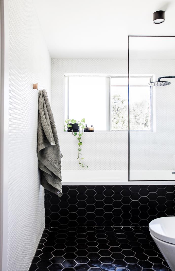 Originally intended to be a beachy bathroom, Mariah eventually changed her design direction, opting for hexagonal matte black floor tiles for a classic, yet modern look.