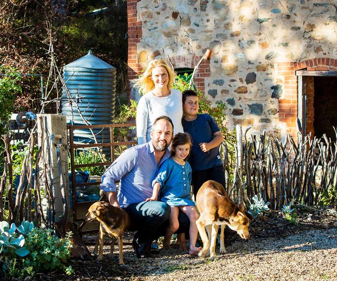Brenton, his wife Libby with their daughter Maya, 5, son Lachie, 9, and two Kelpie crosses Thorby (left) and Bruce (right), all love this reinvigorated garden. | *Photography: Claire Takacs*