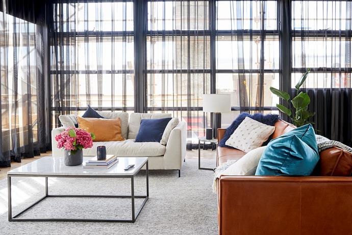 **Living room -** Sophisticated yet warm and inviting, Bianca and Carla's living room is the epitome of understated luxe. Mismatched sofas add texture while the floor-to-ceiling sheer curtains add a cocooning softness to the space.