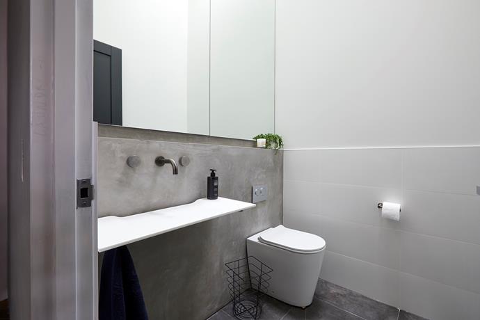 **Powder room -** The concrete splashback, towering mirror and cluster of terrazzo pendants created a sense of raw luxury that impressed the judges immensely.