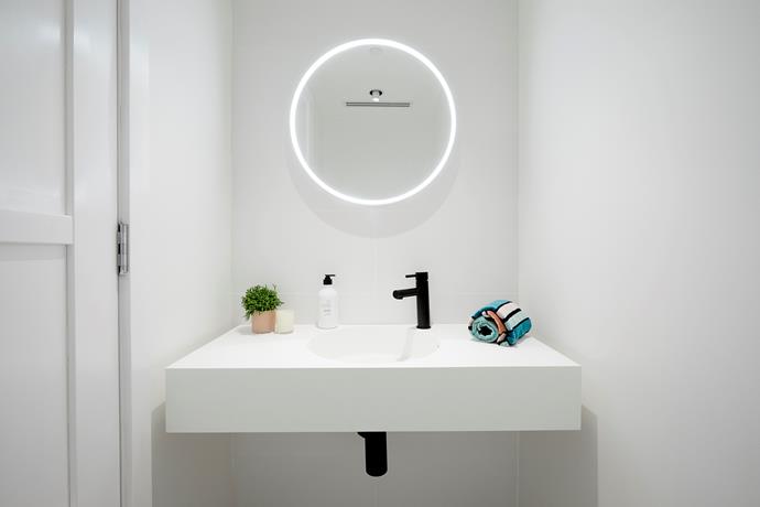 **Powder room** - A round LED mirror was the hero of Hans and Courtney's powder room, which the judges loved. Former contestants [Michael and Carlene weighed in](https://www.homestolove.com.au/the-block-2018-hallway-laundry-powder-rooms-19047|target="_blank") on the room, and said that while they love Hans and Courtney's style, they would have liked to see some natural materials introduced into the space to add warmth.
