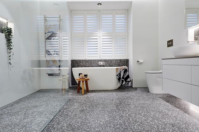 **Ensuite bathroom** - Opting for a bolder version of the same [trendy terrazzo tiles](https://www.homestolove.com.au/terrazzo-trend-2018-marble-5947|target="_blank") they used in the master bathroom, Hans and Courtney created yet another totally on-trend bathing sanctuary. The size of the room, however and some finishing issues brought their score down.