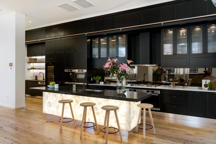 Julia and Sasha's kitchen in The Block 2016's challenge apartment won the pair a perfect score. It featured a backlit Caesarstone white quartz island bench and [sleek black kitchen](https://www.homestolove.com.au/black-kitchens-with-contemporary-appeal-2777|target="_blank") cabinetry.
