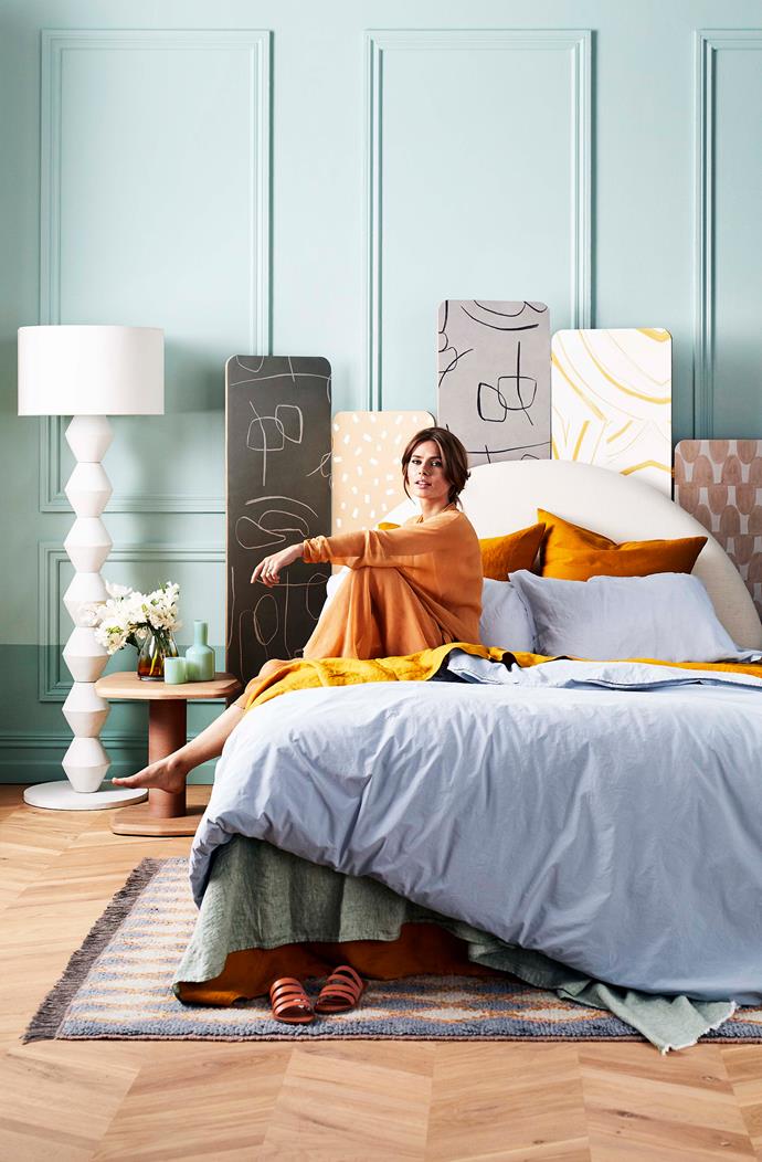 Cuzzi **floor lamp**, $990, from [MCM House](https://mcmhouse.com/product/cuzzi-floor-lamp/|target="_blank"|rel="nofollow"). Stella **bedhead** in Linen Boston Oyster, $1340 for queen, from [Heatherly Designs](https://www.heatherlydesign.com.au/product/stella/|target="_blank"|rel="nofollow"). Stonewash **quilt cover** in Lake, $240 for queen, from [Jardan](https://www.jardan.com.au/product/stonewash-lake/|target="_blank"|rel="nofollow"). 100% Pure French Linen **sheet set** in mustard, $395 for queen, from [I Love Linen](https://www.ilovelinen.com.au/ultra-luxurious-100-pure-french-linen-sheet-set-mustard|target="_blank"|rel="nofollow").