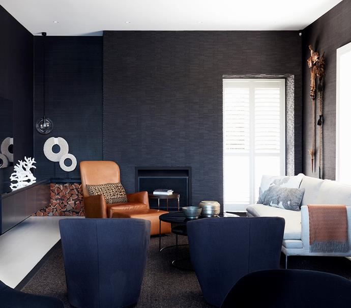 **'Dark heart' by [Brooke Aitken Design](https://www.brookeaitkendesign.com.au/|target="_blank"|rel="nofollow"):** A cosy counterpoint to the light-filled living area, this family/TV room is a much-loved retreat for a Sydney family. Brooke devised a dark-hued scheme to evoke "a night-time cocoon" that would still feel comfortable in daylight hours. Featuring a revamped fireplace and ample seating, 
it's a winner for the whole family. Black sisal wallpaper makes the screen (at left) appear to recede into the wall, placing the focus on the fireplace hearth with its textured tiles. "It's a monochromatic design, but imbued with plenty of texture and materiality, which softens the monumentality of the black elements," says Brooke. *Photo:* Chris Warnes