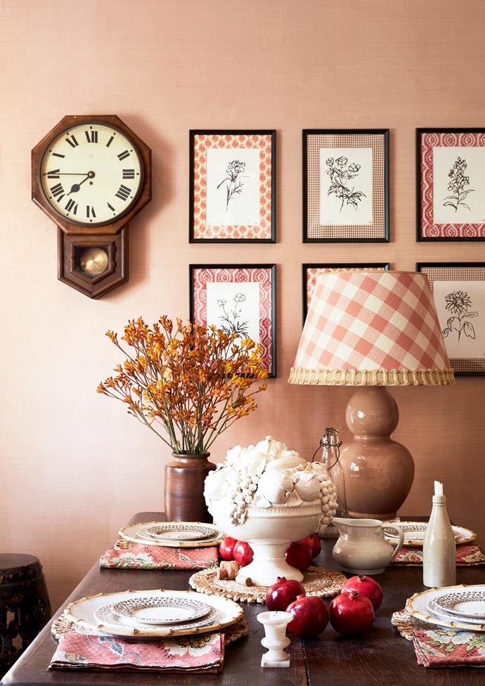 An informal dining room was created in the kitchen space revamped by Adelaide Bragg. The space features a controlled mix of pattern in feminine shades of peaches and pinks.