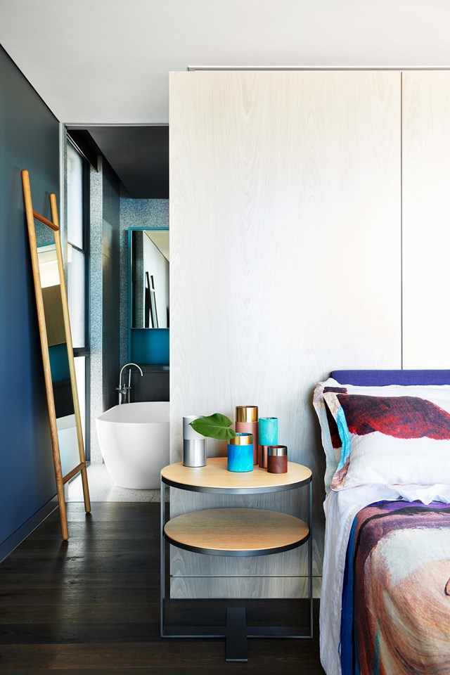 Beyond the master bedroom is a luxe ensuite bathroom clad in terrazzo tiles. The seaside location of this [Palm Springs style beach house](https://www.homestolove.com.au/palm-springs-style-beach-house-19258|target="_blank") in Noosa meant selecting a palette of materials that could cope with the harsh coastal elements and lots of sand. *Photo: Fiona Susanto / Styling: Emma Elizabeth / Story: Belle*