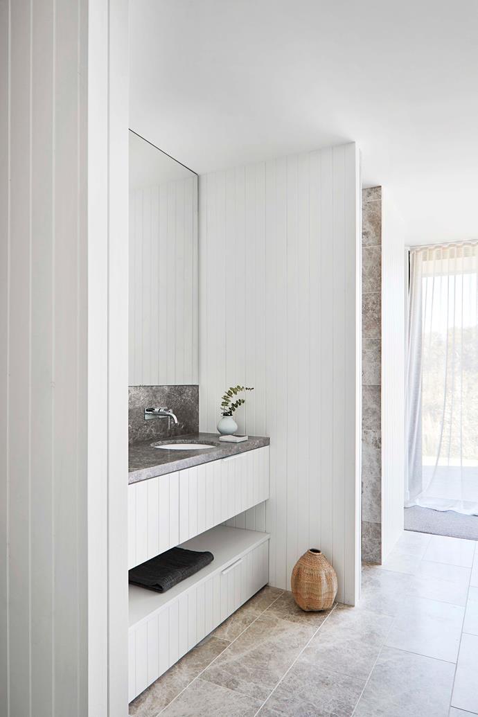 The bathroom features a stone bench with boards in Dulux 'Natural White.'