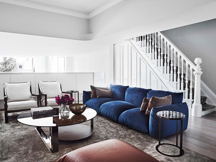 Robust fabrics in deep hues were chosen for the living room in order to withstand the demands of family life.