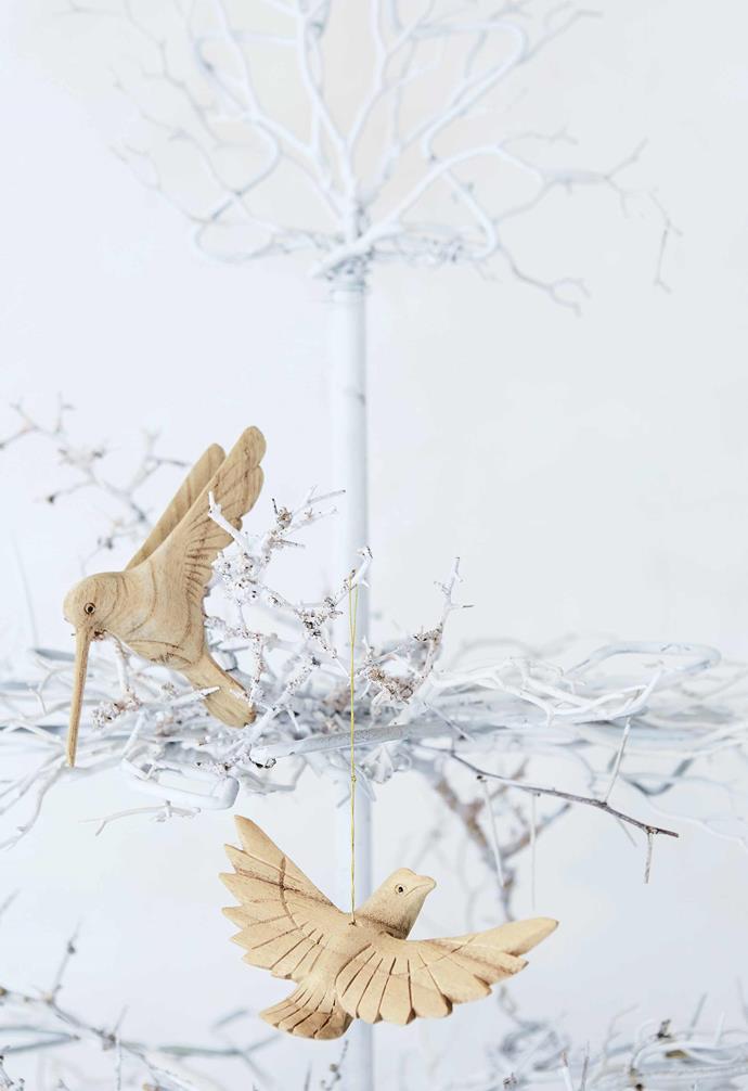 **All in the details** Hand-carved timber birds make the tree feel more like an art installation than decoration. 
*Styling by Shelley Street | Photography by Warren Heath/Bureaux*.