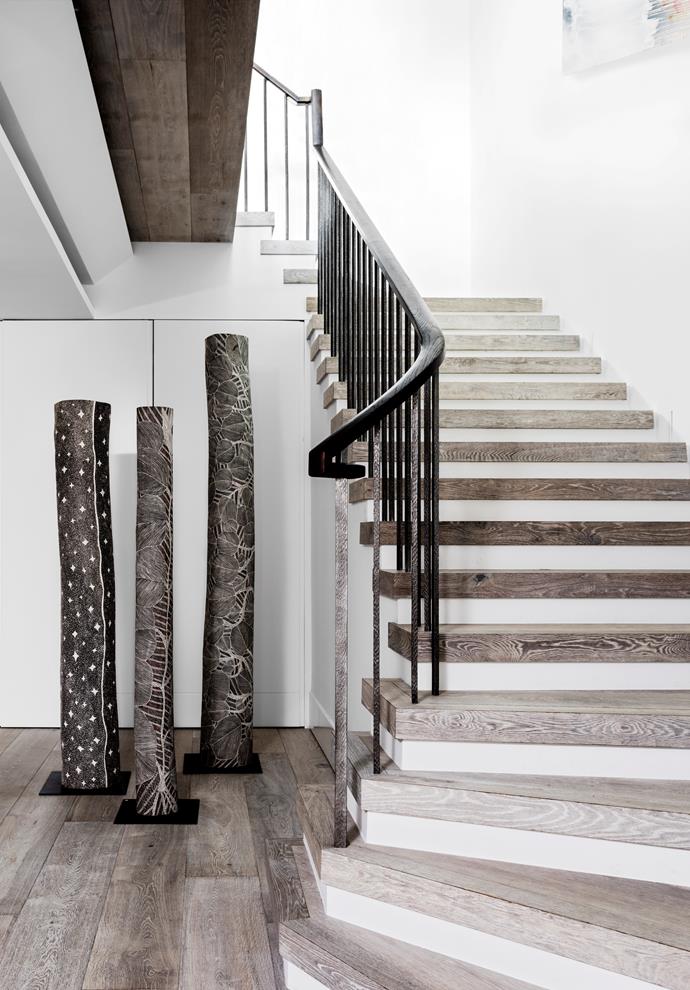 African and Asian antiques soften the hard lines of this staircase in a [high rise haven](https://www.homestolove.com.au/a-high-rise-haven-in-sydney-4268|target="_blank") designed by Thomas Hamel & Associates.