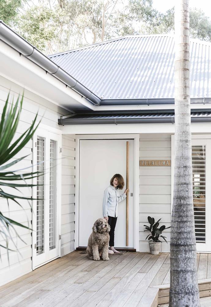 After almost 15 years of living in their home, Nikki and Adam Yazxhi faced a common dilemma. "With our sons aged 14 and 11, we were at a crossroads on whether to sell and buy something bigger, or stay in a house and area we love and renovate to make the house work better," says Nikki.<br><br>**Exterior** The couple's youngest son Zac returns home with Jake the labradoodle. A custom front-door handle was made from blackbutt, also used for the deck. Nikki and Adam specified [Haymes Paint](https://www.haymespaint.com.au//|target="_blank"|rel="nofollow") in Putty Grey for the [exterior walls](https://www.homestolove.com.au/12-exterior-colour-palettes-to-inspire-your-home-renovation-17194|target="_blank") and [Colorbond](https://colorbond.com/|target="_blank"|rel="nofollow") steel in Basalt for the roof. They named the house after their wedding drink, Petaluma Croser sparkling wine. Shutters, [Signature Shutters](https://sigshutters.com.au/|target="_Blank"|rel="nofollow").