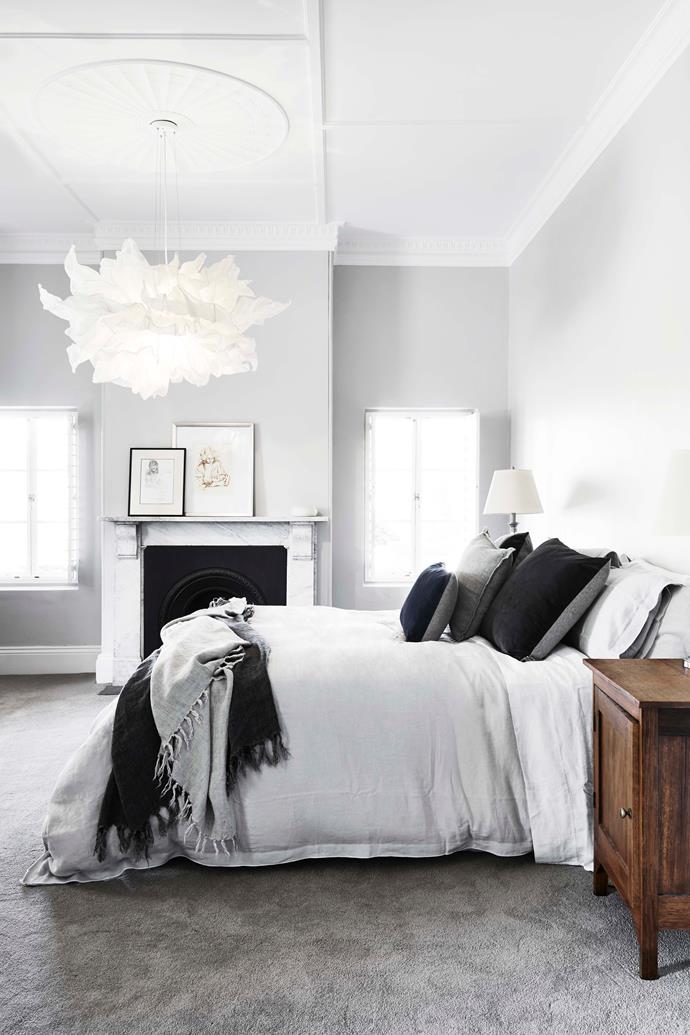 A calming, monochromatic colour scheme was adopted for the master bedroom. The 'Fandango' pendant light is by [Hive](http://www.designbyhive.com/|target="_blank"|rel="nofollow").