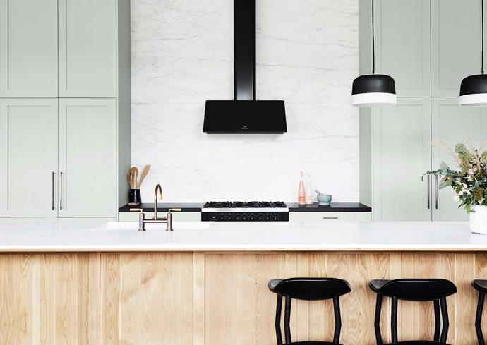 Statuario marble benchtop on American oak in the kitchen. 'Potter' pendant lights from [Anchor Ceramics](https://www.anchorceramics.com/#anchor-ceramics|target="_blank"|rel="nofollow").