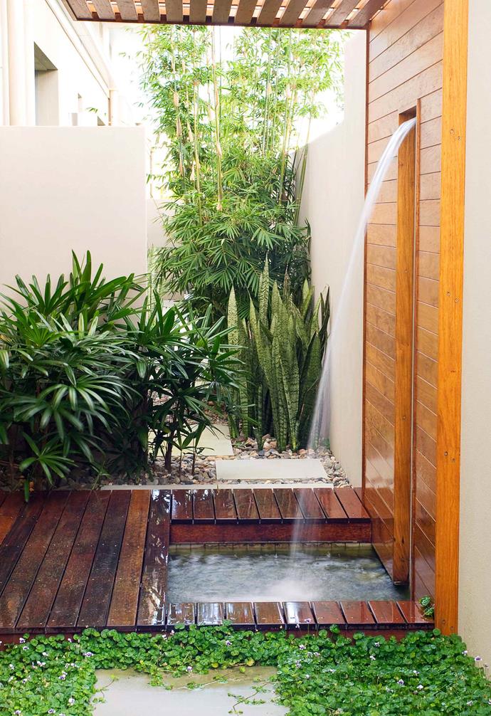 This built-in approach to an outdoor shower would have required a bit more work, but the result is so worth the effort, with a water feature with both decorative and practical purpose.